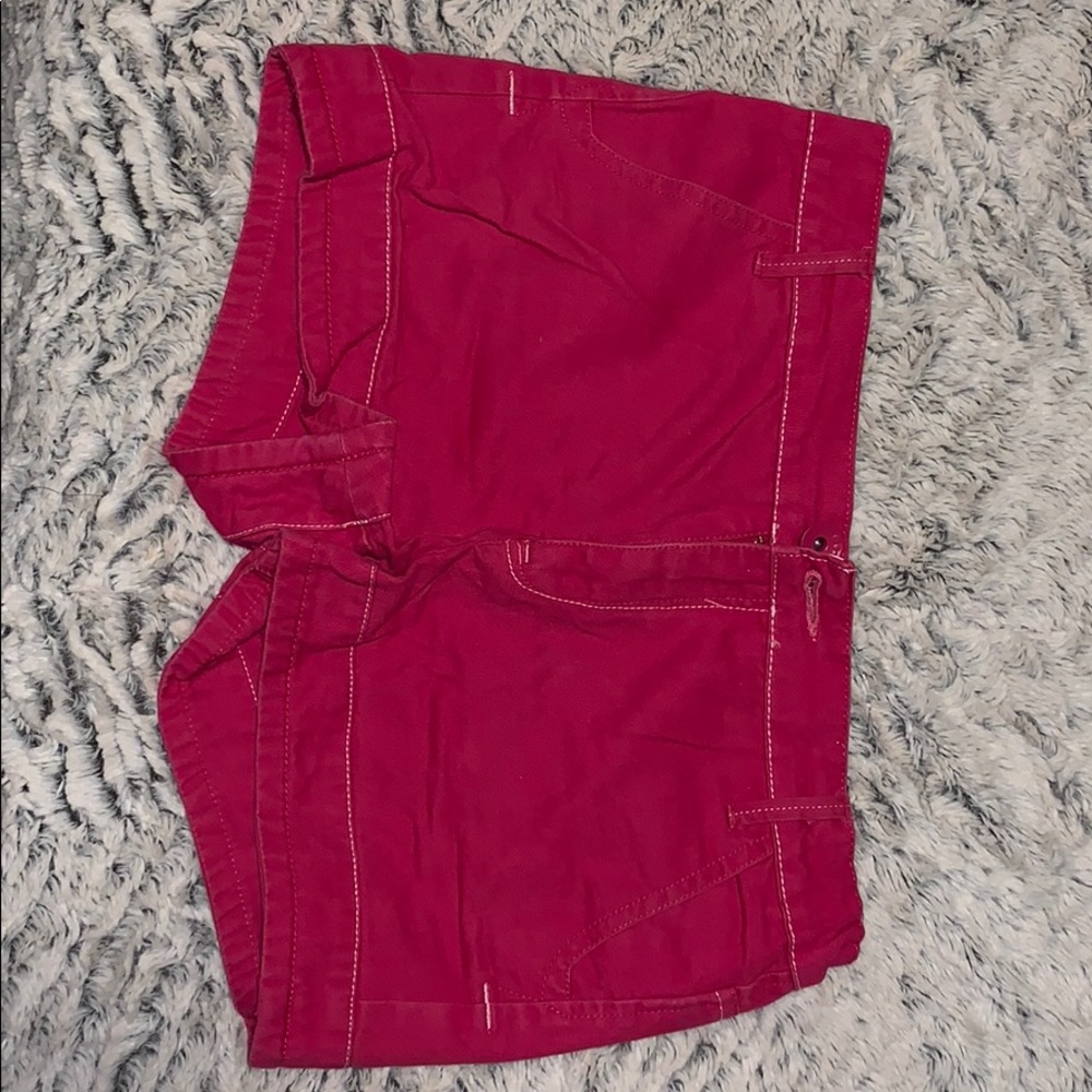 Hot pink shorts.